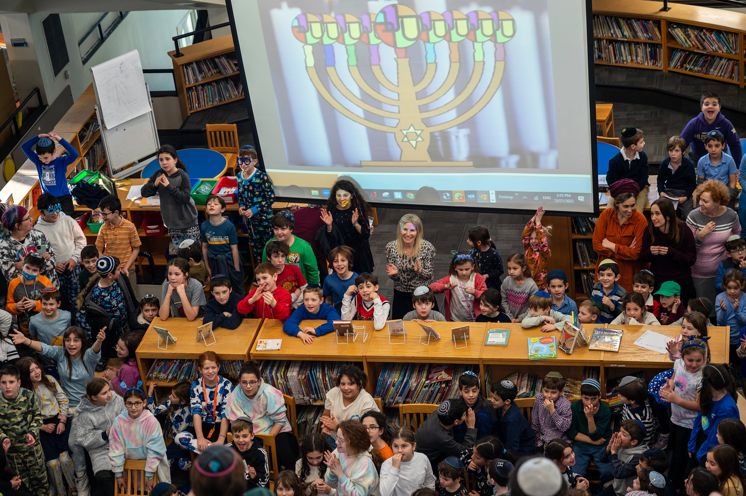 SAR students prepare to light the fourth candle of the menorah on Wednesday, Dec. 21, 2022.
