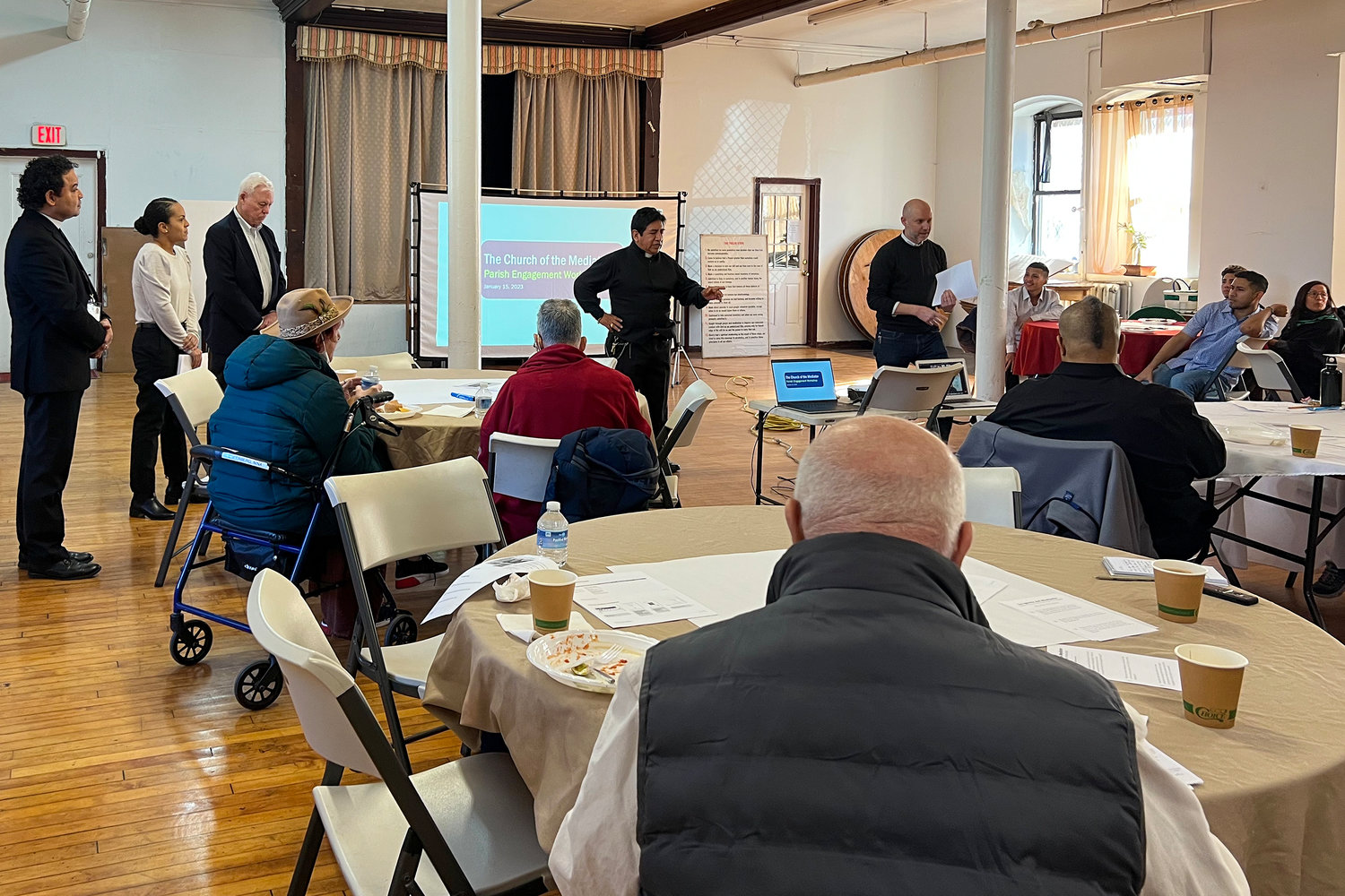 Priest-in-Charge Luis Enrique Gomez, center, makes opening remarks at the parish engagement workshop that took place in the basement of the Church of the Mediator on Kingsbridge Avenue on Jan. 15.