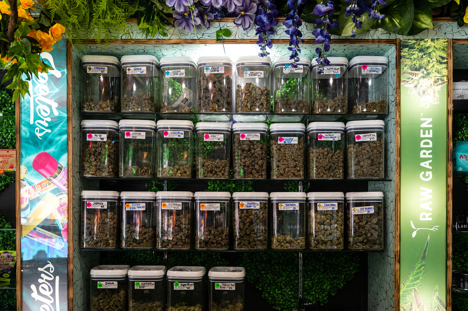 A wide selection of cannabis flower fills a wall display at Pure Leaf, an unlicensed cannabis on Broadway in Kingsbridge on Jan. 9, 2023.