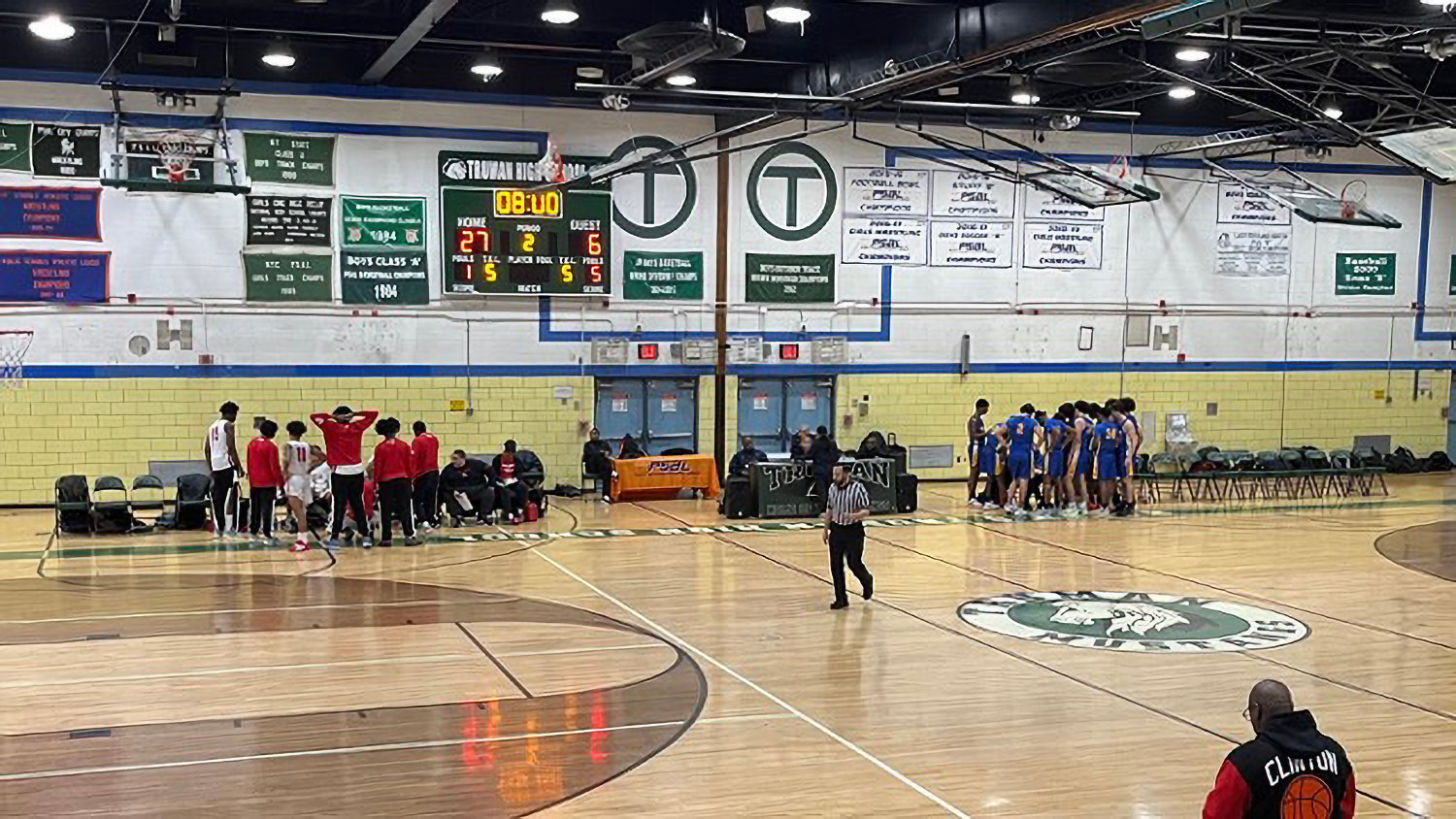 Players from DeWitt Clinton and Truman high schools prep during a timeout of the Governors’ 73-35 thrashing of Truman High School Saturday morning.