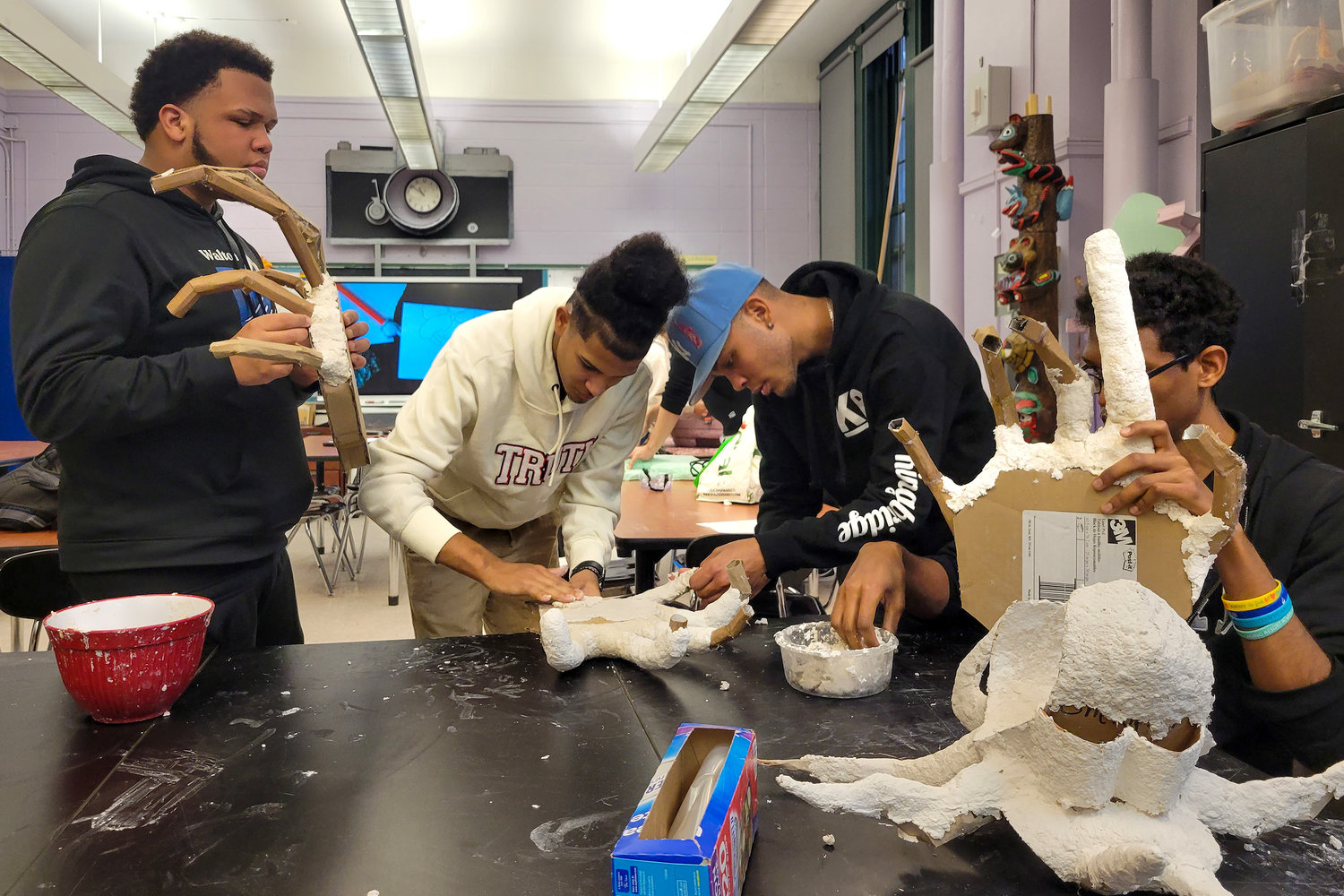 Kingsbridge International High School students along with three teachers, one including visual art teacher Bob Hechler, created puppets out of clay and other recyclables.