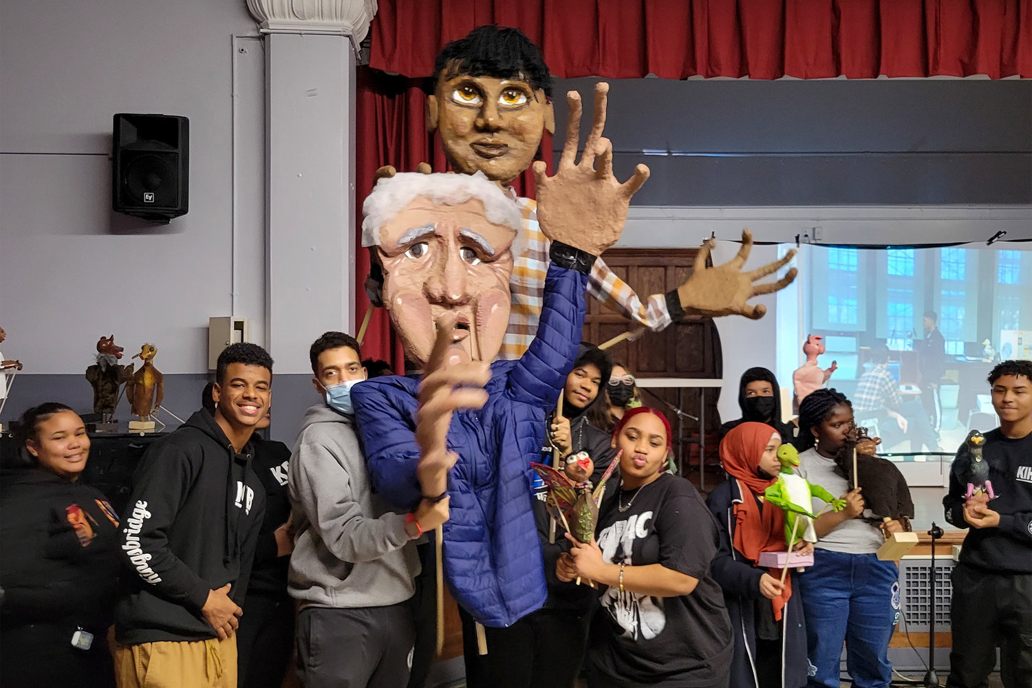 Two large puppets were presented in front of P.S. 65 elementary school students and teachers by students from Kingsbridge International High School.