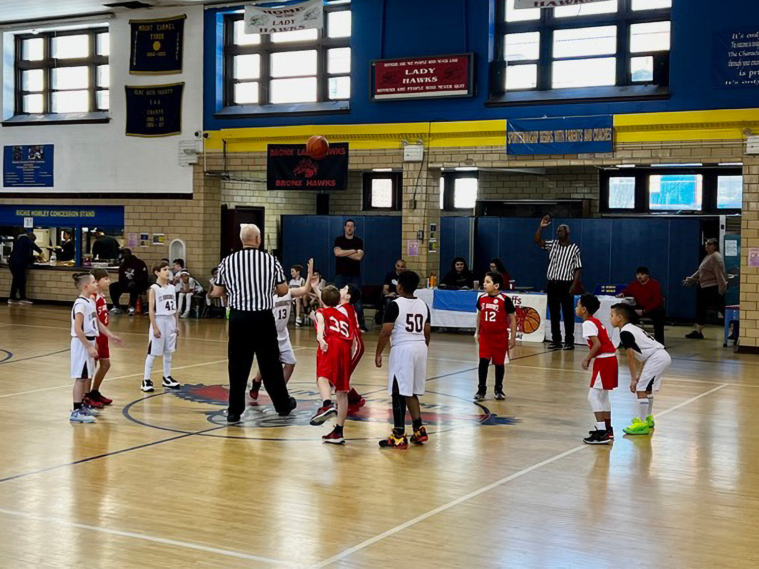 Players in the Bantam division of the CYO tip off during the Bronx county championship game Sunday between St. Margaret of Cortona and Saint Gabriel.