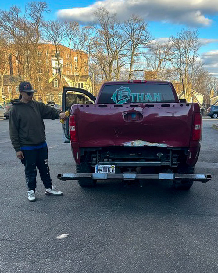 The tow truck driver stands next to his pickup after dropping a car he intended to tow at the Key Food parking lot on Johnson Avenue. The owner said he was charged $75 to ‘drop’ the car.