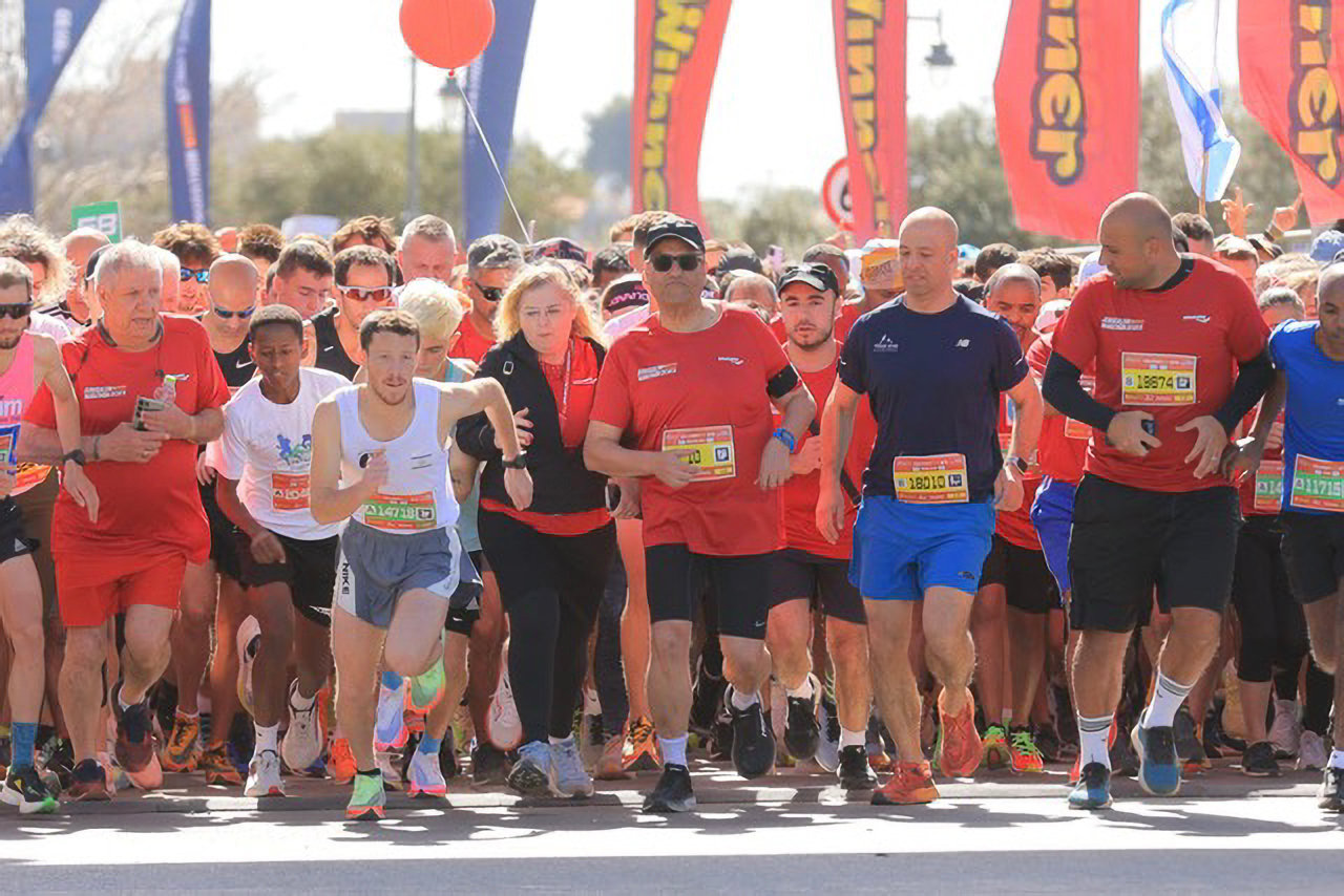 Runners take off at the beginning of the Israel marathon last week. Among them, 15,000 or so finished the race.