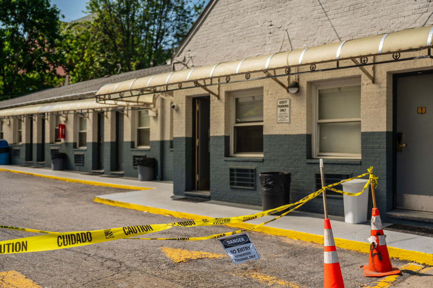 Yellow caution tape is stretched across the driveway of the Van Cortlandt Motel at 6393 Broadway in North Riverdale on Wednesday, May 10.