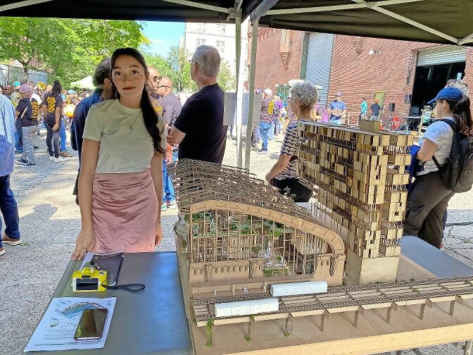 Shiva Abbaszadeh, a student with CUNY’s Spitzer School of Architecture, shows off her team’s model of the proposed Kingsbridge Armory during Sunday’s celebration and EDC announcement about the request for proposals.