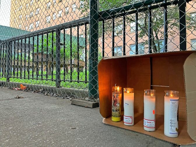 Lit candles were placed Sept. 12 on the spot where Juan Martinez, 44, was fatally stabbed in front of 130 W. 228th St. in Marble Hill on Sept. 5. Martinez’s father, George Laboy, said the candles were purchased by Martinez’s friends.