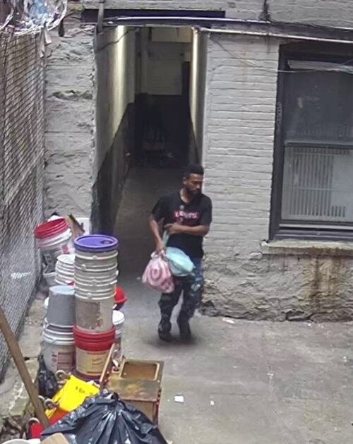 Felix Herrera Garcia is shown on surveillance camera behind the Divino Nino Day Care center on Morris Avenue Sept. 15 carrying out bags of drugs and paraphernalia. He was charged with conspiracy to distribute narcotics resulting in death on Sept. 28. An infant died and three others were hospitalized from fentanyl poisoning.