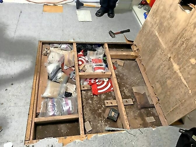Drug Enforcement Administration officers discovered a trap door that contained packets of fentanyl and others labeled "Red Dawn."