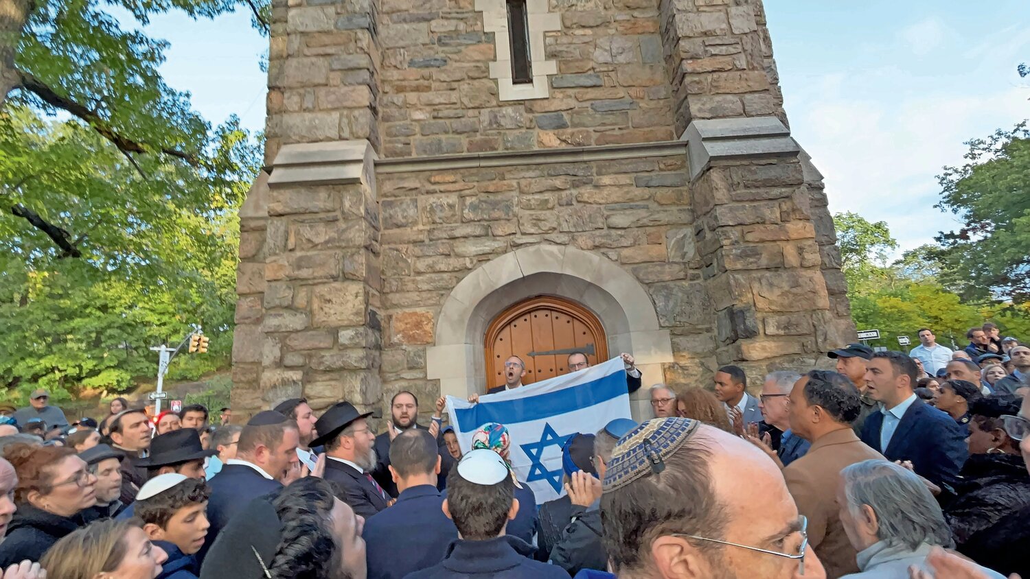 Community members and elected officials joined together in prayer on Simchat Torah, one day after the Hamas attack on Israel at the Bell Tower in Riverdale. Nearly 300 people showed up to stand up for Israel.