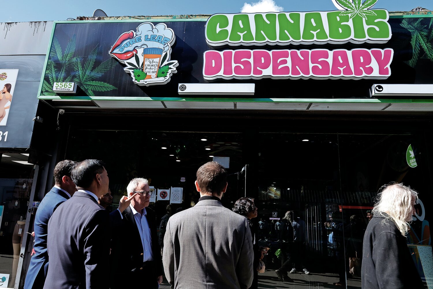 Councilman Eric Dinowitz, Assemblyman Jeffrey Dinowitz, and Small Business Services Commissioner Kevin Kim stand outside of Pure Leaf Cannabis Dispensary at 5565 Broadway on Monday, Oct. 16. Illegal smoke shops have been a hot topic for contention for local business owners.