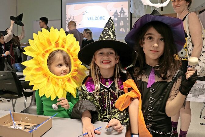 Three children dressed in their Halloween best who took part in Manhattan College’s annual Halloween celebration on Oct. 27.