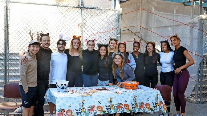 Members of the Manhattan College women’s soccer team gave out candy to local area students from greater Riverdale on Oct. 27. They took some time out from the festivities for a 'class photo.'