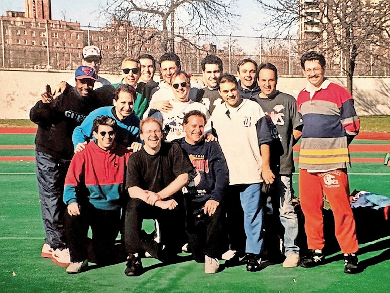 Members of the earlier iterations of the Turkey Bowl in northwest Bronx pose for a team photo. The games started out in 1974 with a 4 on 4 format and have grown to about 20 or so players, including later generations of the original players.