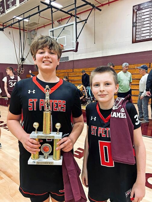 The sixth grade team from St. Peter’s River Edge took first place in the Patrick Joyce Memorial Tournament that honors the Riverdale native and firefighter who was tragically killed in a Yonkers fire in 2009. Joyce’s nephew, Pat Jr., right, was all smiles with his teammate and the tournament’s most valuable player Luke Koth.