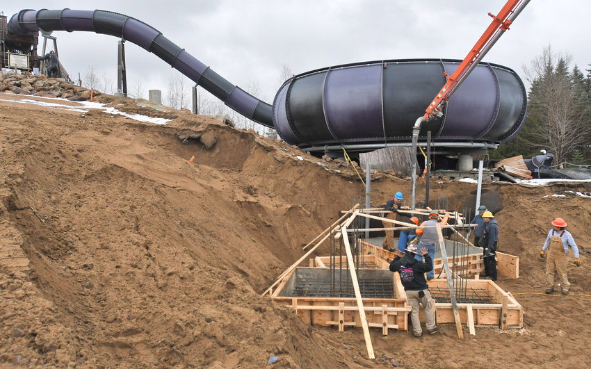 NEW RIDE READY FOR ACTION &mdash;&nbsp;Crews pour footers for a new waterslide at Enchanted Forest Water Safari in Old Forge in this fall 2019 file photo. The park was to unveil three new rides in 2020 before the park was unable to open because of the COVID-19 pandemic. In the background is one of the park&rsquo;s signature rides: The Curse of the Silverback.