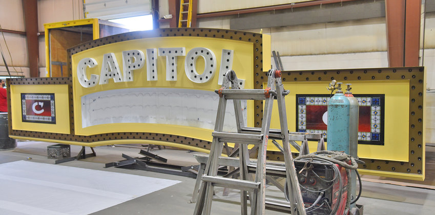 GOING UP IN LIGHTS &mdash;&nbsp;A portion of the Capitol Theatre&rsquo;s new marquee is prepared for installation on Monday. The marquee will be a beacon for the city&rsquo;s growing arts district, according to the Capitol&rsquo;s Executive Director Art Pierce.