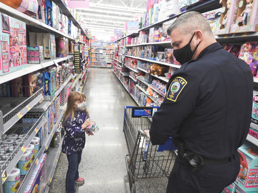 SHOPPING FOR THE FAMILY &mdash; Five-year-old Jasmine Ludwig was one of 84 children participating in the Oneida Police Department&rsquo;s Shop with a Cop event on Saturday. Like many other children, Willoh had her family on her shopping list.