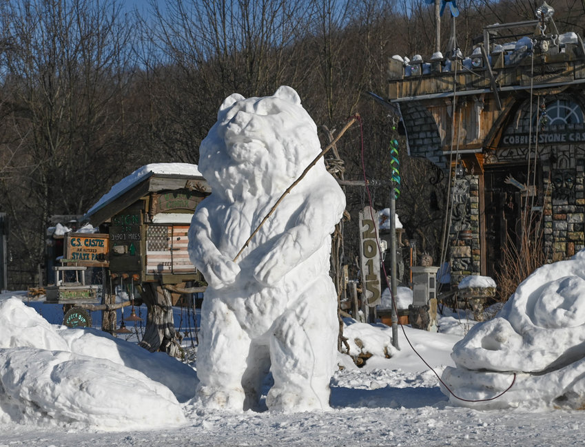 GONE SNOW FISHING &mdash;&nbsp;A snowbear gets a big bite from an equally massive snow fish sculpture in a yard along Route 46, a couple miles south of Boonville, on Tuesday afternoon. These two creations could have plenty of company in the coming days as a massive snowstorm was expected to dump nearly a foot of snow over much of the region by the time it ends on Friday &mdash; leaving plenty of white stuff behind for creative pursuits, snowmobiling, skiing and other outdoor activities.