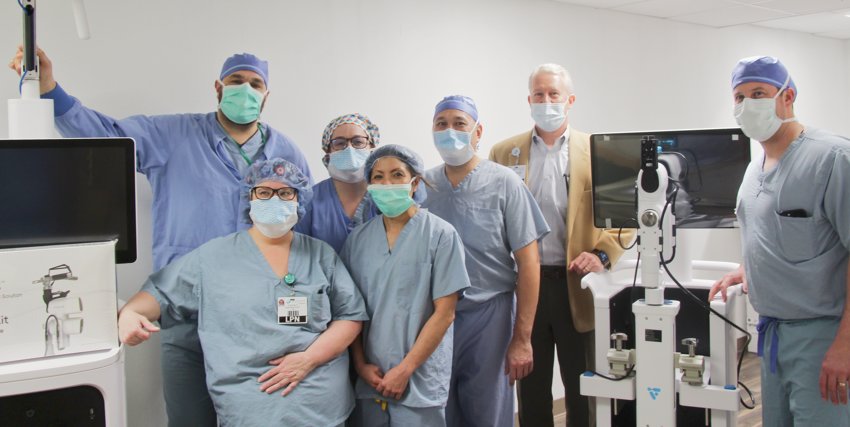 ROBOTICS SURGERY &mdash; Members of Community Memorial&rsquo;s surgical team stand with Dr. Richelle Takemoto and President and CEO Jeff Coakley, along with the new robotics equipment.