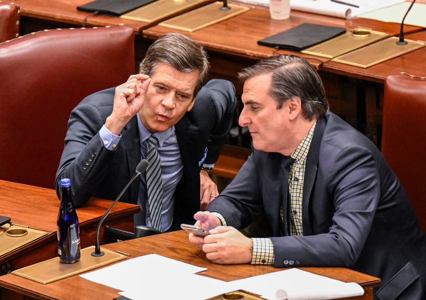 State Sen. Brad Hoylman, D-New York, left and Senate Deputy Majority Leader, Michael Gianaris, D-Astoria, talk during a legislative session in the Senate Chamber at the state Capitol on Friday in Albany.
