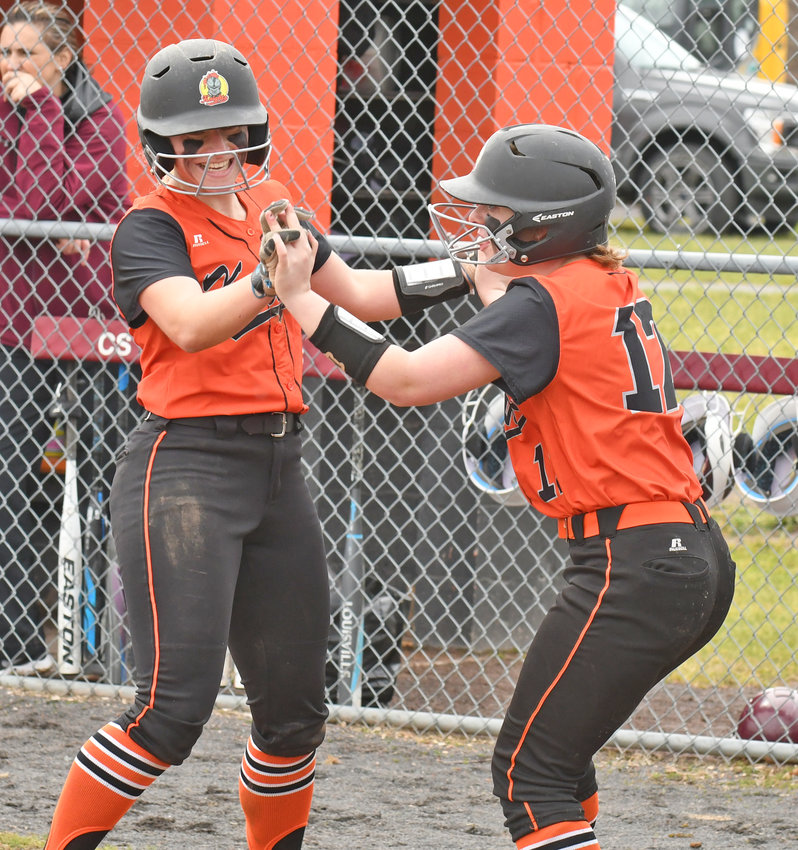 BACK IN ACTION &mdash;&nbsp;Rome Free Academy seniors Lauren Dorfman, left, and Laina Beer celebrate the first run scored in the first inning against Central Square Saturday. Dorfman tripled in her first at-bat after missing all of last season due to injury, then came in to score on a single by Maggie Closinski. The Black Knights opened the season with an 8-0 non-league win.