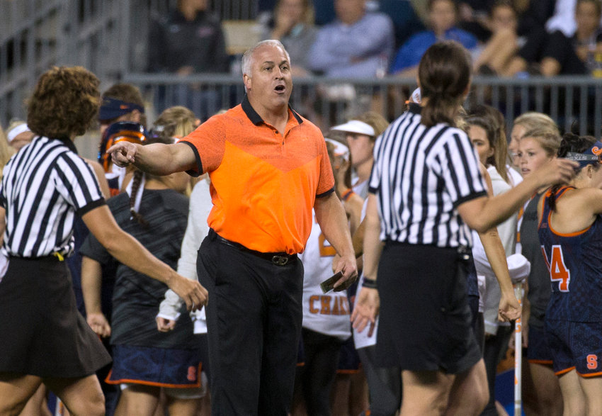 TAKING WITH OFFICIALS &mdash; Gary Gait, center, at the time Syracuse women&rsquo;s lacrosse coach, talks with officials during the first half of a semifinal in the NCAA Division I women&rsquo;s lacrosse tournament against Maryland, May 22, 2015, in Chester, Pa. Gait&rsquo;s first year as men&rsquo;s lacrosse coach at Syracuse has been a challenge.