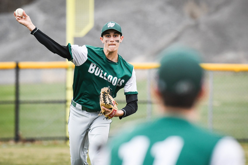 Westmoreland's Hunter Kierpiec throws to first base during the game against Adirondack on Monday. The Bulldogs won 11-0.