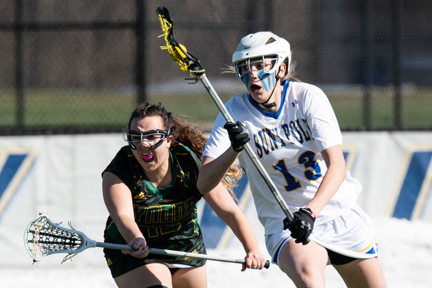 LEADING THE WAY &mdash; SUNY Polytechnic Institute women&rsquo;s lacrosse player Molly Burdick (13) moves in for a shot during the game against Northern-Vermont Lyndon on Wednesday. Burdick, of Vestal, scored 10 goals and had one assist as the Wildcats won their first game of the season with an 18-4 victory.