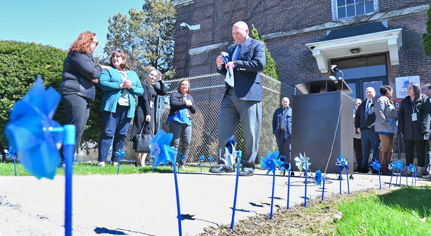 WINDY DAY &mdash; Blue and white pinwheels spin in the wind outside the Oneida County Child Advocacy Center in Utica on Thursday. County leaders take time every April to spread awareness of the facility&rsquo;s work, placing pinwheels in the ground as a symbol.