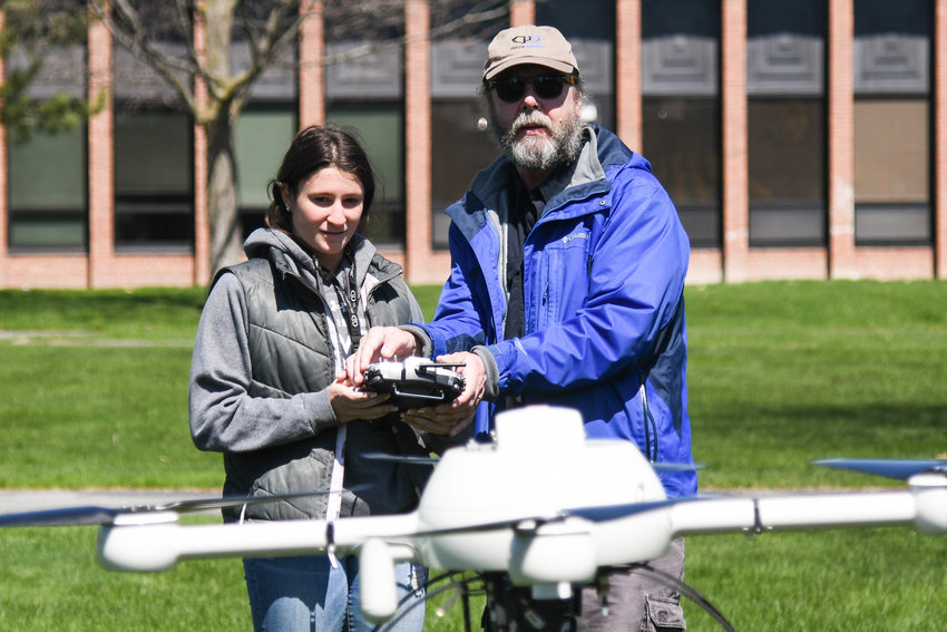 Instructor Bill Judycki helps Cooperstown resident Sarah Feik fly a drone during the 2022 Drone Festival at Mohawk Valley Community College in Utica. The event featured interactive drone demonstrations, racing drone and flight demos, hands-on racing simulators and more. Attendees also had an opportunity to fly a mini drone or hovercraft.
