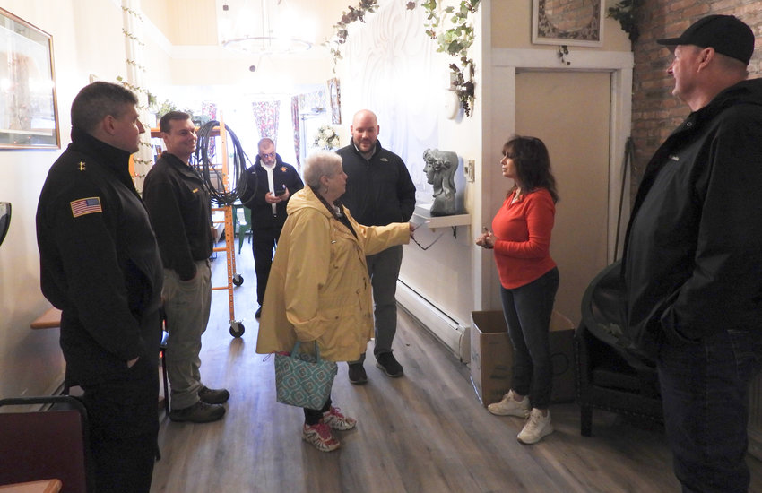 City officials meet and speak with Bella Vita owner Lori Seef in the store&rsquo;s upcoming expansion right next door. The new expansion features a larger kitchen with plans to offer things like freshly baked bread