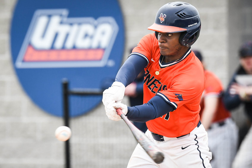 SPLITTING THE SERIES &mdash; Utica University&rsquo;s Shamariah McCullough swings at a pitch during Game 1 of the Empire 8 semifinal doubleheader against Russell Sage College on Friday at home. McCullough had an RBI single as part of a five-run first inning to help Utica to a 12-0 victory. Clinton&rsquo;s Matt Fitzgerald added three RBIs for Utica. Whitesboro&rsquo;s Ryan Cardone allowed six hits in seven innings to pick up the win. In Game 2, Sage broke a 1-1 tie with two runs in the fifth to earn a 4-1 win. Utica (20-16 overall) and Sage will meet again at noon Saturday for a winner-take-all Game 3.