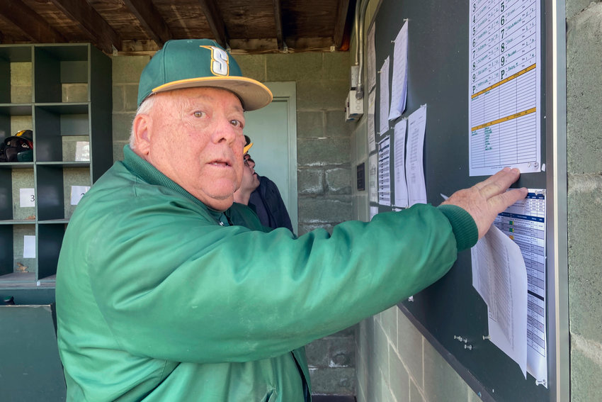Siena College baseball coach Tony Rossi looks at a lineup after a game in Loudonville on April 29. Rossi is in the stretch of his 53rd year at the helm of the Saints. He&rsquo;s the longest-tenured coach in Division I and at age 78 has no thoughts of retirement.