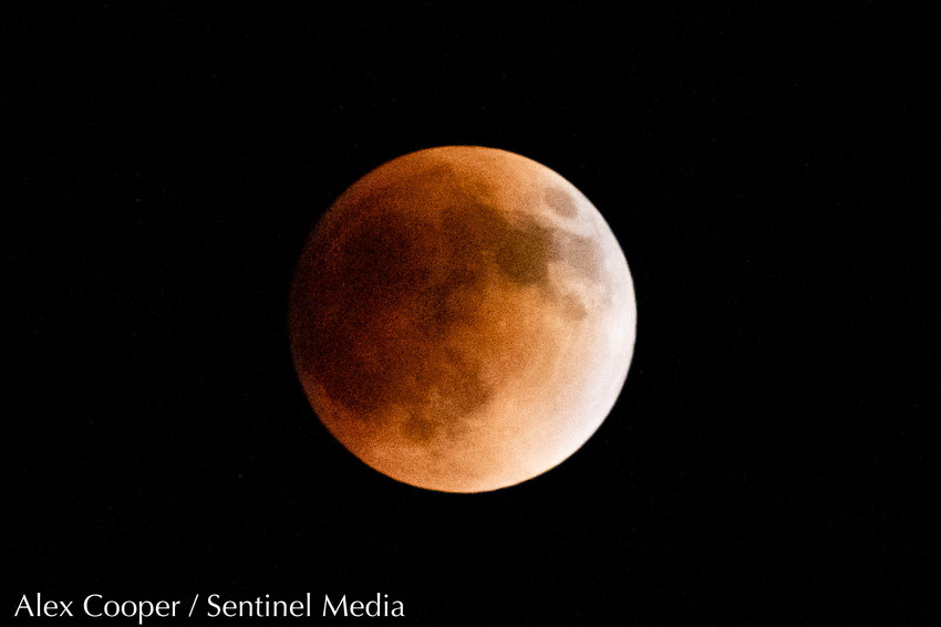 A lunar eclipse formed a blood moon on late Sunday night (May 15, 2022) and the early hours of Monday morning. During a full lunar eclipse, the moon passes through the darkest part of the Earth's shadow. When the moon is within the umbra it gets a reddish hue because blue and green light get more easily scattered by dust particles in the atmosphere and orange and red colors remain more visible, according to NASA. Lunar eclipses are sometimes called blood moons because of this phenomenon.