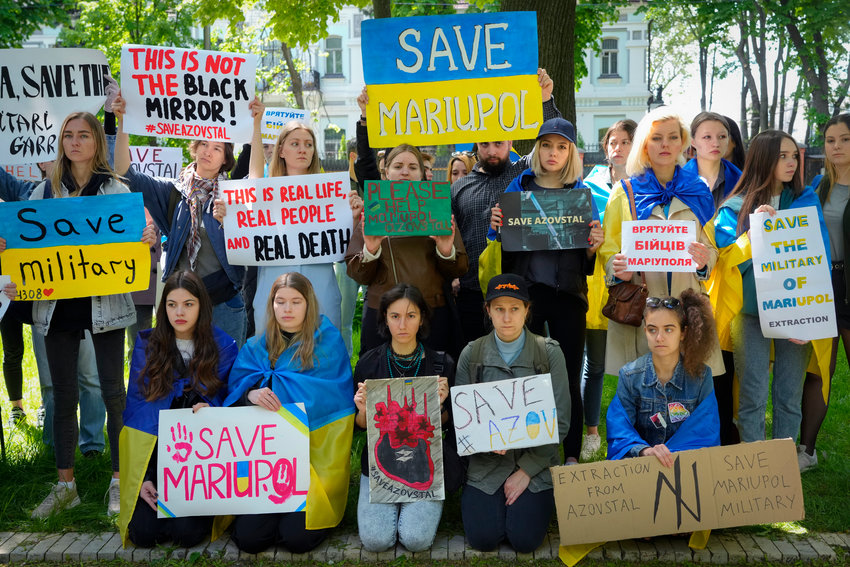 Ukrainian women picket in front of the Chinese embassy in Kyiv, Ukraine, Tuesday. Wives and mothers of the defenders of Mariupol urgedTurkish President Recep Tayyip Erdogan and Chinese President Xi Jinping to save Ukrainian fighters from the besieged city of Mariupol.