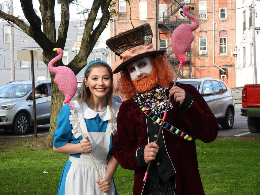 Local children play flamingo croquet with Alice, recreating a scene from &quot;Alice in Wonderland&quot; as part of the Oneida Parks and Recreation Department's &quot;Through the Looking Glass&quot; event, with members of the Bogardus Performing Art Center take the role of beloved characters.