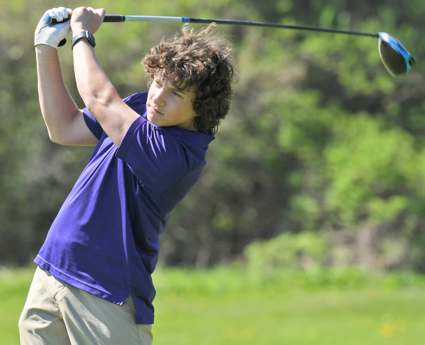 Holland Patent freshman Jacob Olearczyk watches his drive during a recent match this spring. He&rsquo;s trying to qualify for the state tournament.