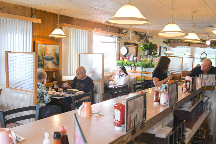 Guests eat breakfast at Charlie&rsquo;s Place in Clinton.