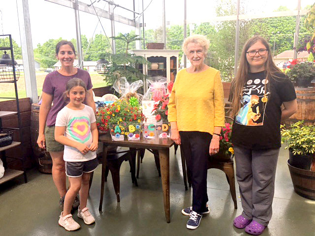 HOSPITAL HELPERS &mdash; The Ming Twigs of the Rome Twigs recently held a basket raffle to raise funds to benefit Rome Health. Winning tickets were drawn by Chloe Jones, daughter of Rebecca and Pete Jones, owners of R. Jones Nursery and Landscaping, 7871 Ridge Mills Road. From left: Rebecca Jones; Chloe Jones; Rita Reilley, of the Rome Twigs; and Madalyn Rood. The raffle raised $600.