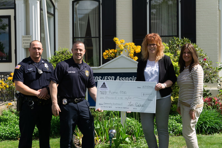 The EOS/ESD Association presents a donation of $1,000 to the Philip S. McDonald Police Benevolent Association. From left, James Bristol, vice president of the Philip S. McDonald PBA; Jeff Buckley, president of the Philip S. McDonald PBA; Lisa Pimpinella, executive director of the EOS/ESD Association, Inc.; and Alison J. Swartz, program manager for the EOS/ESD Association, Inc.