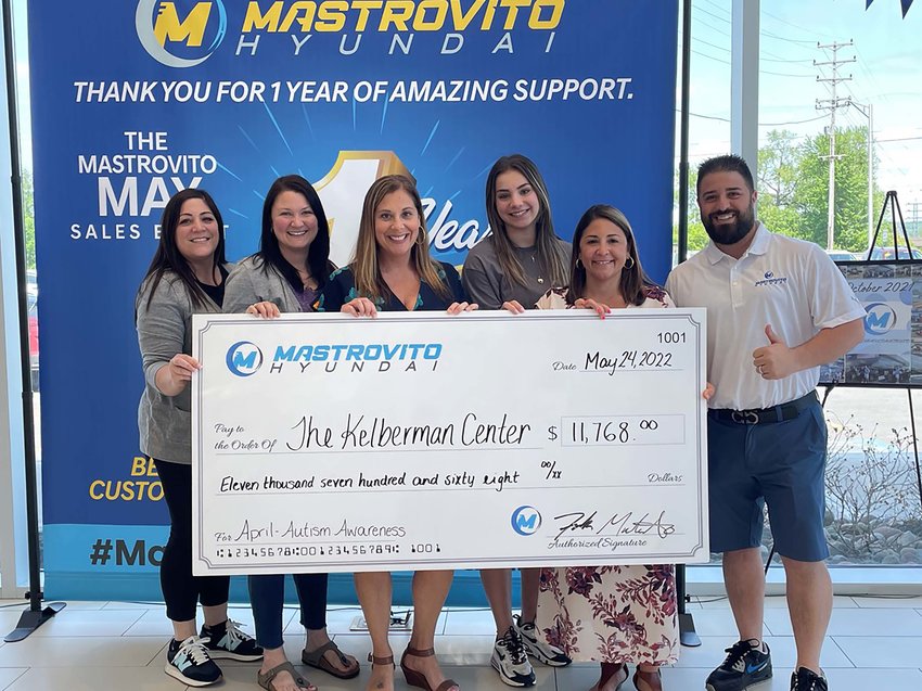 Representatives of Mastrovito Hyundai, 5194 Commercial Drive in Yorkville, and the Kelberman Center pose with a check for $11,768 to celebrate a donation from the company to the Kelberman Center to support programs and services for individuals and families impacted by autism. From left: Gina Mastrovito-Smith; Coleen Mastrovito; Kelly Carinci, Kelberman Center chief development and communications officer; Samantha Mastrovito-Smith; Tara Costello, Kelberman Center executive director; and Frank Mastrovito.
