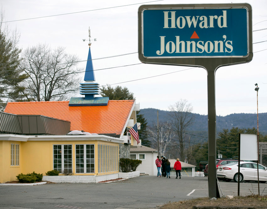 Customers walk into Howard Johnson's Restaurant in Lake George on April 8, 2015. The Howard Johnson's restaurant in this upstate New York resort village &mdash; the last of the once-pervasive eateries serving food under orange roofs with blue spires &mdash; is closed.