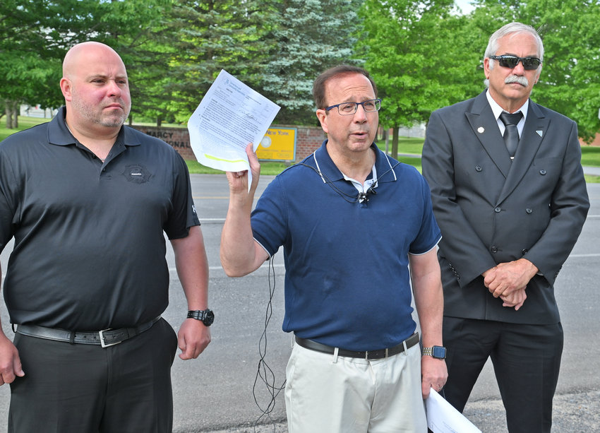 State Sen. Joseph A. Griffo, flanked by Brian Hluska and Don Roberts of the  New York State Correctional Officers &amp; Police Benevolent Association, speaks with the media following an unannounced visit to the Marcy Correctional Facility on Friday.