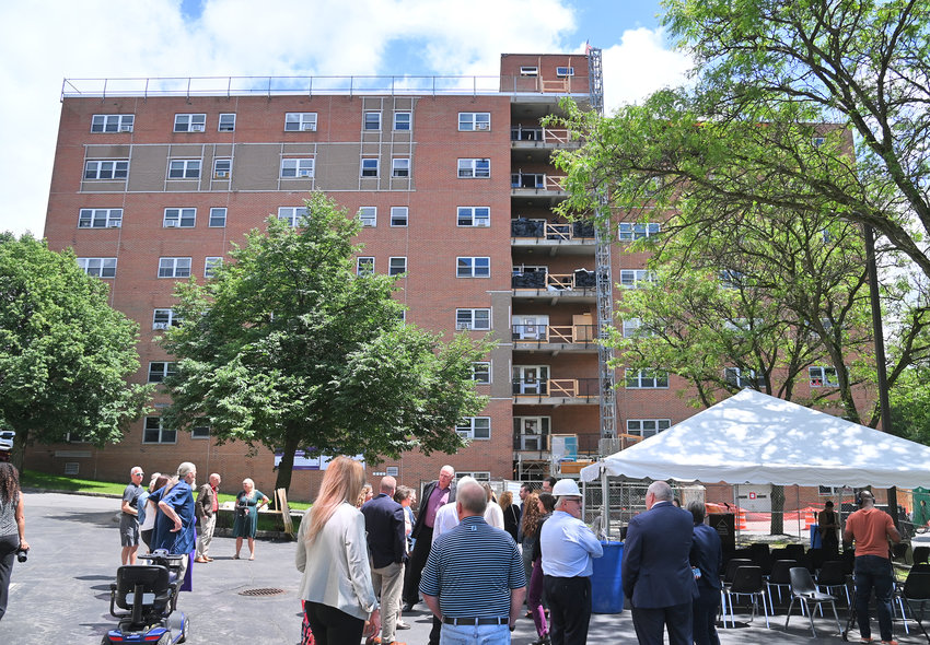 Local and state officials gather for a press conference and ground breaking ceremony for Colonial II Apartments, on Cottage Street, in Rome, which will become the state&rsquo;s first carbon-neutral public housing building.