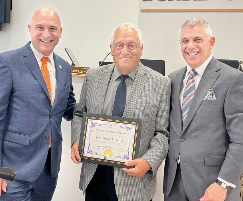 County Board of Legislators Chair Gerald Fiorini, R-7, center, accepts an award on Wednesday. From left: NYSAC Executive Director Stephen Acquario; Fiorini; and Oneida County Executive Anthony J. Picente, Jr.