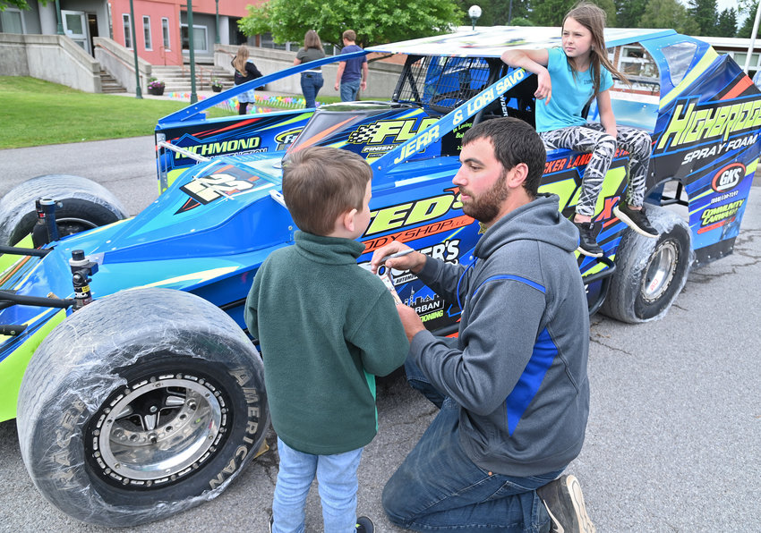 GETTING A GOOD LOOK &mdash; Sportsman standout driver Michael Richmond answers questions from Ivan Crawford, 4, about his race car Thursday at the Touch A Truck event J. D. George Elementary School in Verona. Sitting on the door of the race car is Sophie Suits. Also at the event was a Verona Fire Department truck, Oneida County Sheriff&rsquo;s Office police car, Town of Verona dump/plow truck, garbage truck, food truck and boom truck. Richmond will be racing tonight at Utica-Rome Speedway, where admission will be $5 at the track in Vernon. For more information, visit uticaromespeedway.com.