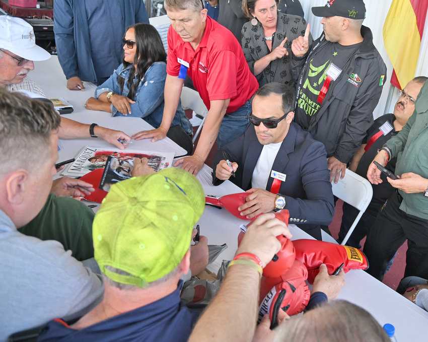 Juan Manuel Marquez signs autographs before getting his fist cast Friday afternoon at the International Boxing Hall of Fame. The member of the Hall's Class of 2020 won world titles in four weight divisions &mdash; featherweight, super featherweight, lightweight and light welterweight.