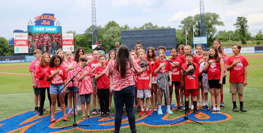 PERFECT PITCH &mdash; Members of the chorus at Denti Elementary School, 1001 Ruby St., Rome, sing the national anthem before the start of a Syracuse Mets game on Sunday. The group, under the direction of music teacher Sarah Anderson, received a rousing round of applause by the crowd, following the performance.